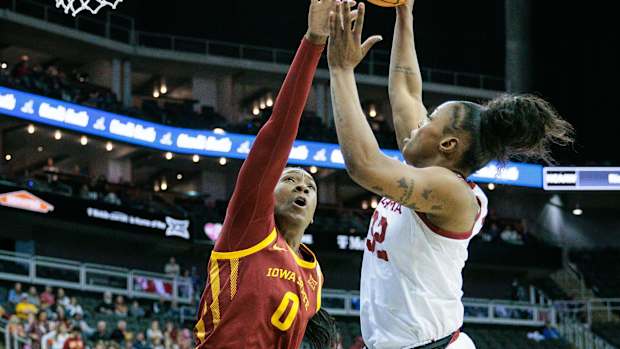Mar 11, 2024; Kansas City, MO, USA; Oklahoma Sooners forward Sahara Williams (32) shoots the ball over Iowa State Cyclones center Isnelle Natabou (0) during the first half at T-Mobile Center. Mandatory Credit: William Purnell-USA TODAY Sports